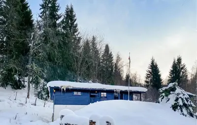 a blue building with snow on top of it at Lovely Home In Stranda With Wifi in Stranda