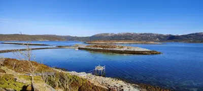 an island in the middle of a large body of water at Apartment Solbakken Feriehus in Fevåg