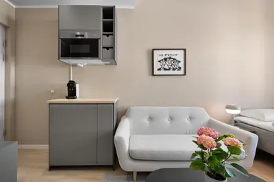 a living room with a couch and a chair at Bohemian Hotel - Self-Service in Bergen