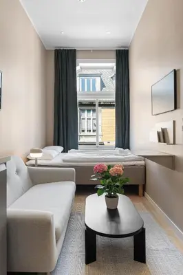a living room with two beds and a couch at Bohemian Hotel - Self-Service in Bergen