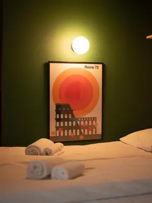 a bedroom with a bed with a picture of a building at Unique Studio I Custom Built I 500 Meters From Bryggen in Bergen