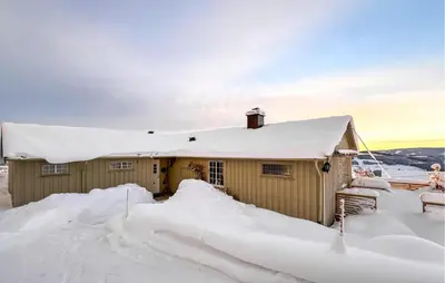 a house covered in snow with snow around it at Amazing Home In Svingvoll in Svingvoll