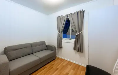 a living room with a couch and a window at Awesome Home In Ånneland With Wifi in Ånneland