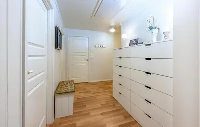a room with a white dresser and a stool at Awesome Home In Ånneland With Wifi in Ånneland
