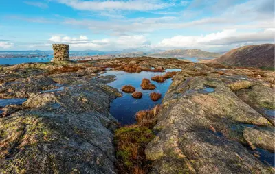 a group of rocks on a mountain with water at Awesome Home In Ånneland With Wifi in Ånneland