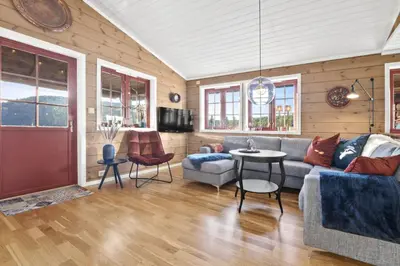 a living room with a couch and a table at Hytte Stryn skisenter in Stryn