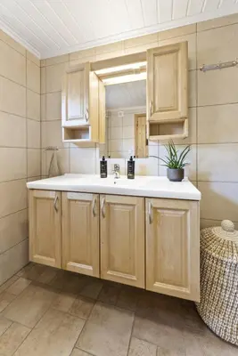 a bathroom with a sink and a mirror at Hytte Stryn skisenter in Stryn