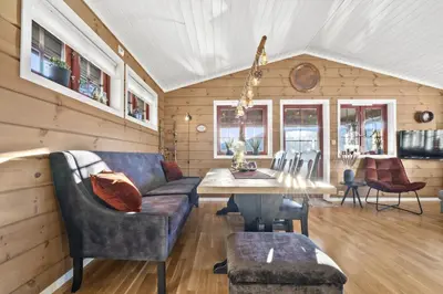 a living room with a couch and a table at Hytte Stryn skisenter in Stryn