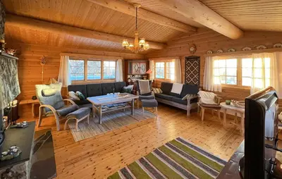 a living room with a couch and a table at Awesome Home In Venabygd With Sauna in Venabygd