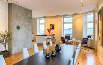 a dining room with a table and chairs at 1 Bedroom Stunning Apartment In Ålesund in Ålesund