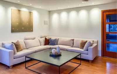 a living room with a couch and a table at Pet Friendly Home In Ålesund in Ålesund