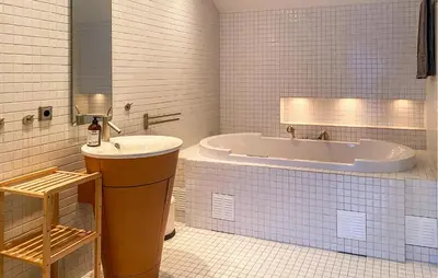 a bathroom with a tub and a sink at Pet Friendly Home In Ålesund in Ålesund