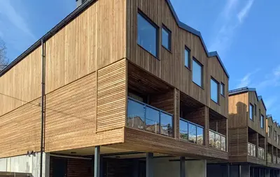 a building with a wooden facade with windows at Gorgeous Home In Bjorli With Wifi in Bjorli