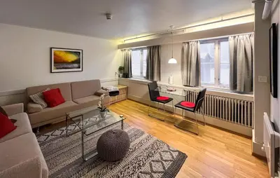 a living room with a couch and a table at Gorgeous Apartment In Lillehammer in Lillehammer