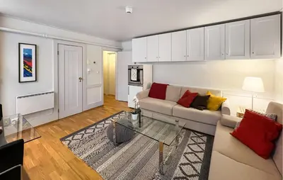 a living room with a couch and a table at Gorgeous Apartment In Lillehammer in Lillehammer