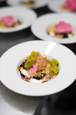 a white plate of food on a table at Hotel Aak in Åndalsnes