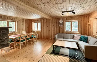 a living room with a couch and a table at 2 Bedroom Nice Home In Aust- Torpa in Aust-Torpa