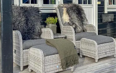 a pair of wicker chairs sitting on a porch at 3 Bedroom Gorgeous Home In Bjorli in Bjorli