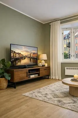 a living room with a large flat screen tv at Modern apartment in the heart of Bergen in Bergen