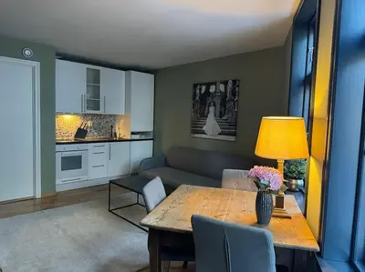 a living room with a table and a couch at Peaceful Urban Residence in Bergen