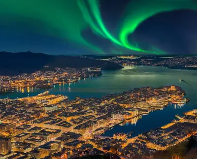 an aerial view of the aurora over a city at Peaceful Urban Residence in Bergen