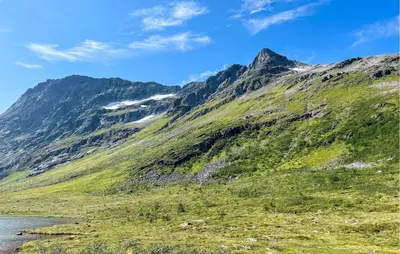 a mountain with a river in front of it at 2 Bedroom Lovely Home In Innfjorden in Innfjorden