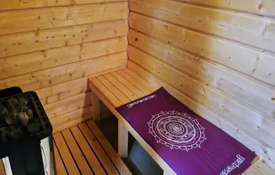 a book sitting on a bench in a sauna at 4 Bedroom Pet Friendly Home In Tydal in Tydal