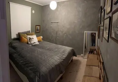 a bedroom with a large bed in a room at Cabin by the Fjord in Øksendalsøra