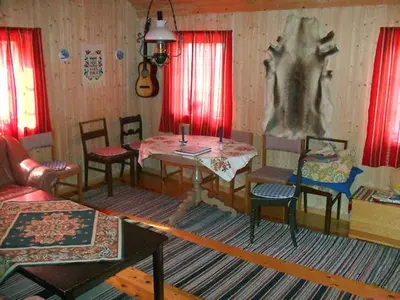 a living room with a table and chairs at Orset setra - back to basic cabin - with amazing view in Torvikbukt