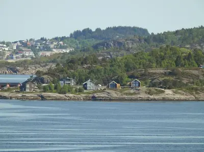 a group of houses on an island in the water at Brattøya sjøstuer in Kristiansund