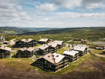 an aerial view of a campus with buildings at Kikut Alpin Lodge 2302 in Geilo