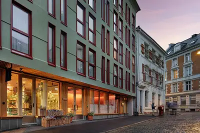 a row of buildings on a city street at Skostredet Hotel & Spa in Bergen