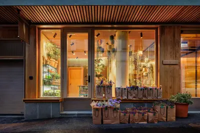 a store front of a flower shop with flowers at Skostredet Hotel & Spa in Bergen