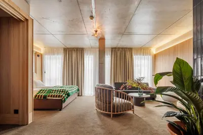 a hotel room with a bed and a couch at Skostredet Hotel & Spa in Bergen