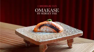 a piece of sushi sitting on top of a table at Skostredet Hotel & Spa in Bergen