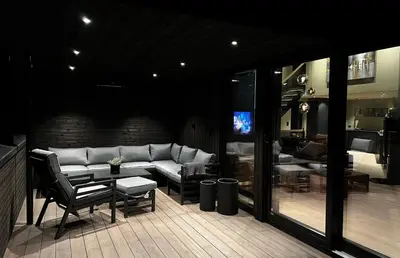 a living room with a couch and a table at Trilodge - Unique cabin with high standard, views, ski in & out, attractive location in Meråker