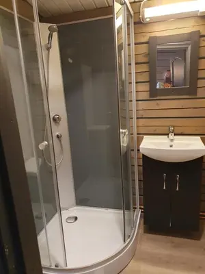 a bathroom with a shower and a sink at Bjørgebu Camping AS in Mysusæter