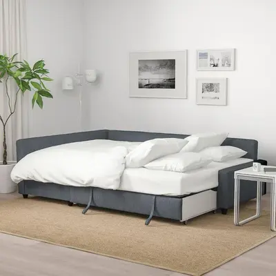 a bed with white pillows on it in a room at City View & Central Location in Trondheim