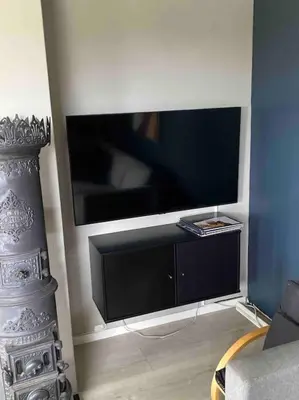 a living room with a large flat screen tv at Spacious house near city centre - WSC 2025! in Trondheim