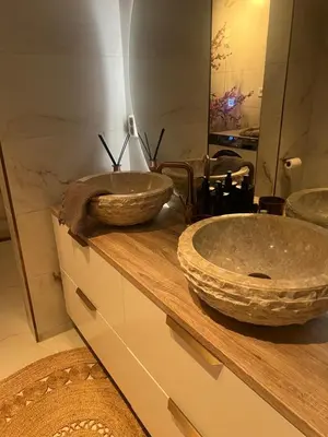 a bathroom with two sinks on top of a counter at Sentral leilighet i Trondheim in Trondheim