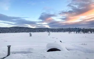 a field covered in snow with trees in the background at Cozy Home In Gol With Sauna in Golsfjellet