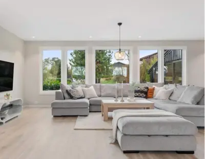 a living room with a couch and a table at Tranquil Haven Villa in Ålesund