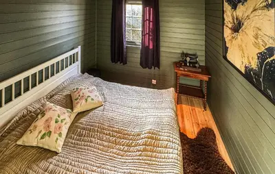 a bedroom with a large bed in a room at Awesome Home In Fevåg With Wifi in Fevåg