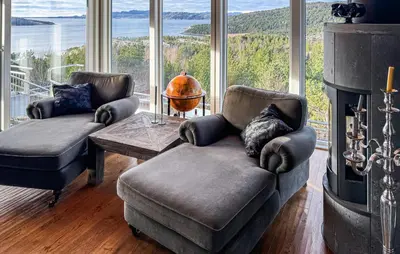 a living room with a couch and a fireplace at Awesome Home In Fevåg With Wifi in Fevåg