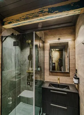 a bathroom with a sink and a shower at Bokhandel'n Gjestehus in Vågåmo