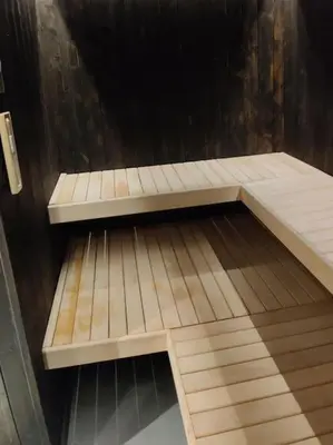 a wooden bench sitting on top of a wooden floor at Fritt beliggende stor enebolig med høy standard in Rjukan