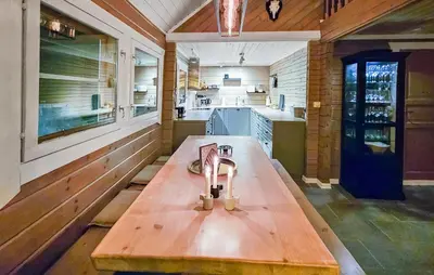 a kitchen with a wooden table in the middle at Gorgeous Home In Uvdal With Wifi in Uvdal