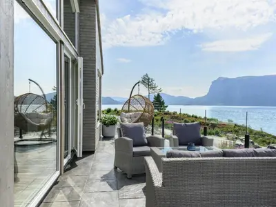 a patio with a view of the water at Holiday Home Hildebu by Interhome in Sørbø