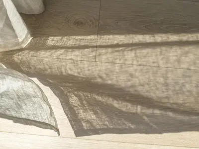 a shadow of a curtain on a wooden floor at Holiday Home Hildebu by Interhome in Sørbø