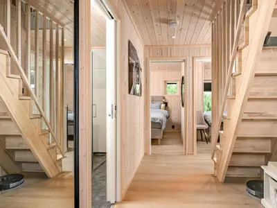 a hallway of a house with wooden floors and stairs at Holiday Home Hildebu by Interhome in Sørbø